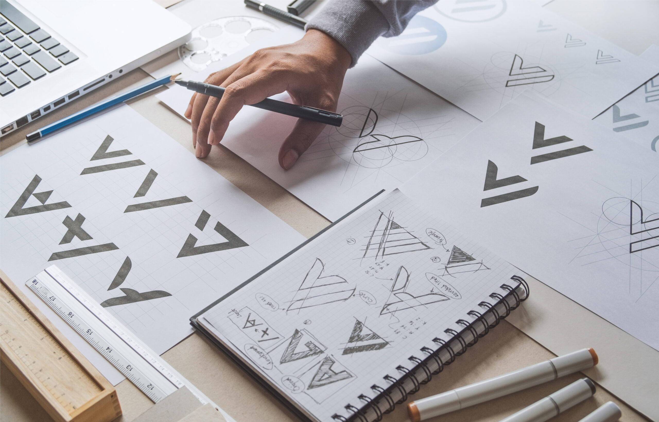 Hand-drawn logo design sketches and brand identity brainstorming at YMVRSL Reklam Ajansı in Ankara, Turkey.