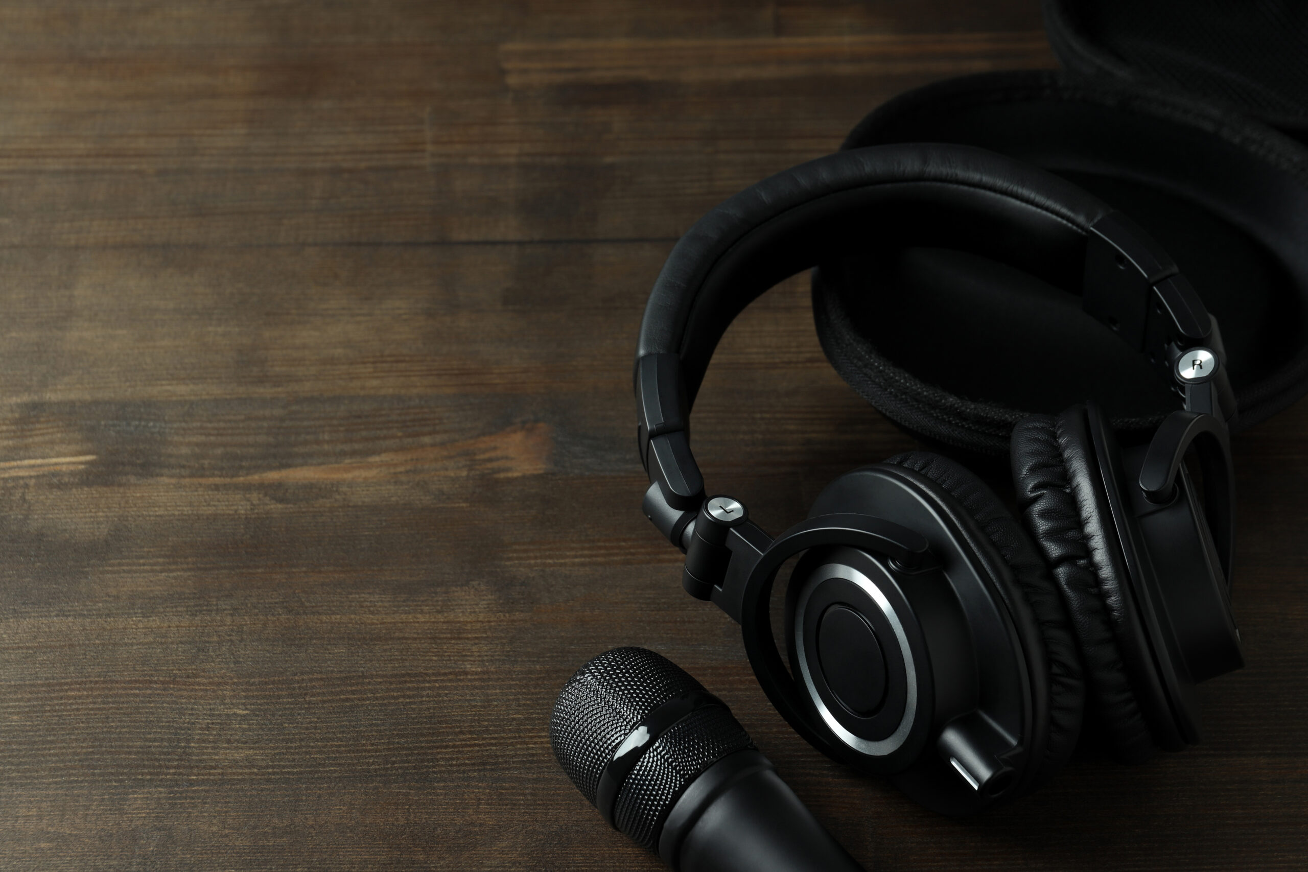 Professional studio headphones and condenser microphone on a table at YMVRSL Reklam Ajansı in Ankara, Turkey.